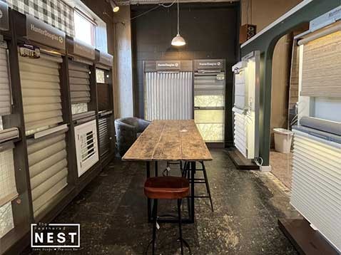 Store interior showcasing several different types of window coverings